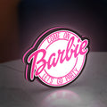 Barbie LED lightbox standing on a desk from an angled side view with pink glow