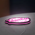 Barbie LED lightbox lying flat on a desk with pink glow