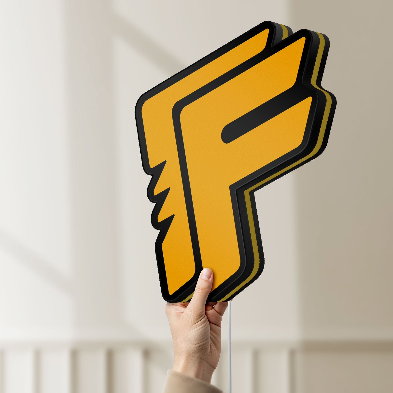 Unlit Free Fire LED lightbox held by hand to show size and details