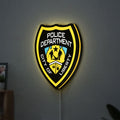 Liberty City Police LED lightbox hanging on a wall with yellow glow