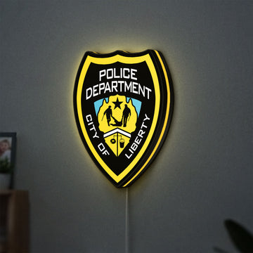 Liberty City Police LED lightbox hanging on a wall with yellow glow