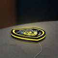 Liberty City Police LED lightbox lying flat on a desk with yellow glow
