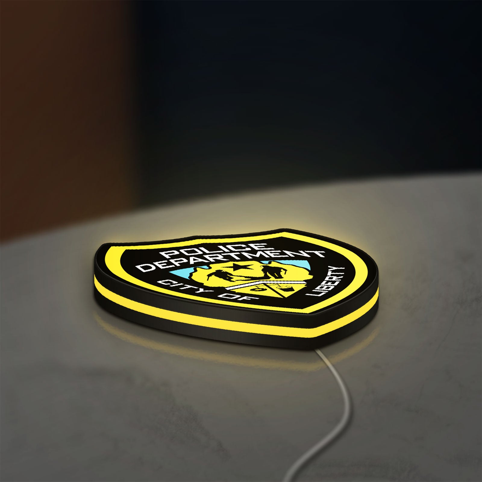 Liberty City Police LED lightbox lying flat on a desk with yellow glow