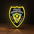 Front view of Liberty City Police LED lightbox sign glowing on a wooden desk