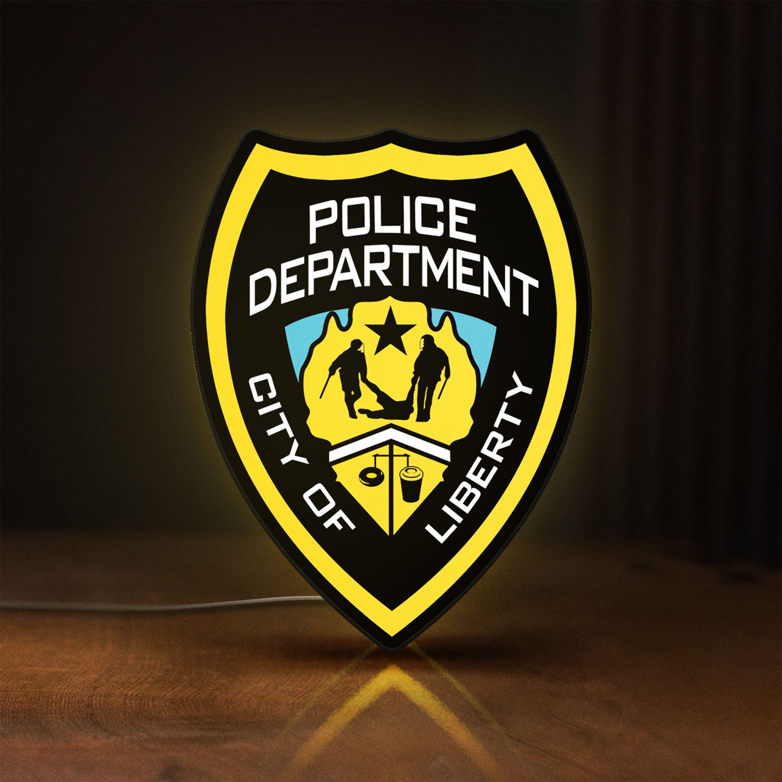 Front view of Liberty City Police LED lightbox sign glowing on a wooden desk