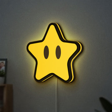 Super Mario Star LED lightbox hanging on a wall with yellow glow
