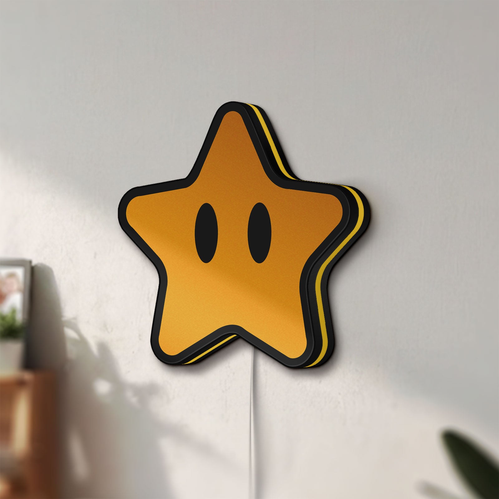 Unlit Super Mario Star LED lightbox mounted on a wall in daylight