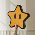 Unlit Super Mario Star LED lightbox held by hand to show size and details
