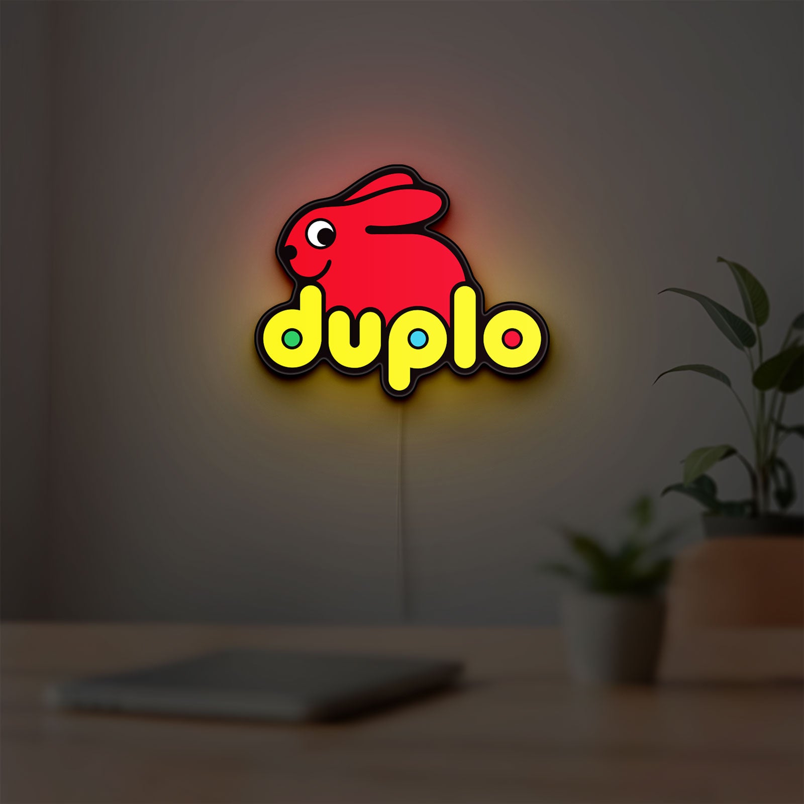 Duplo Lego LED lightbox hanging on a room wall with soft yellow light