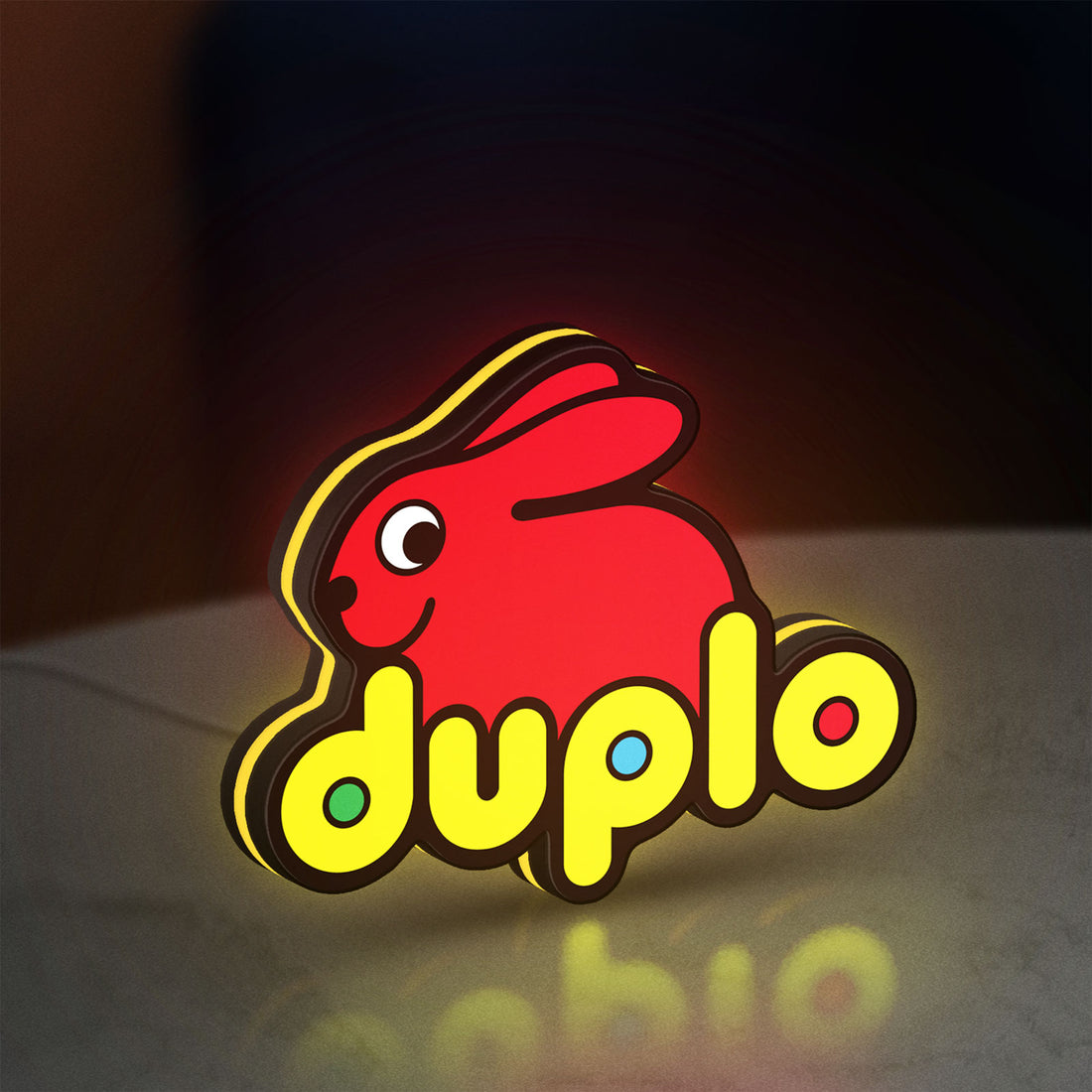 Duplo Lego LED lightbox hanging on a wall with yellow glow