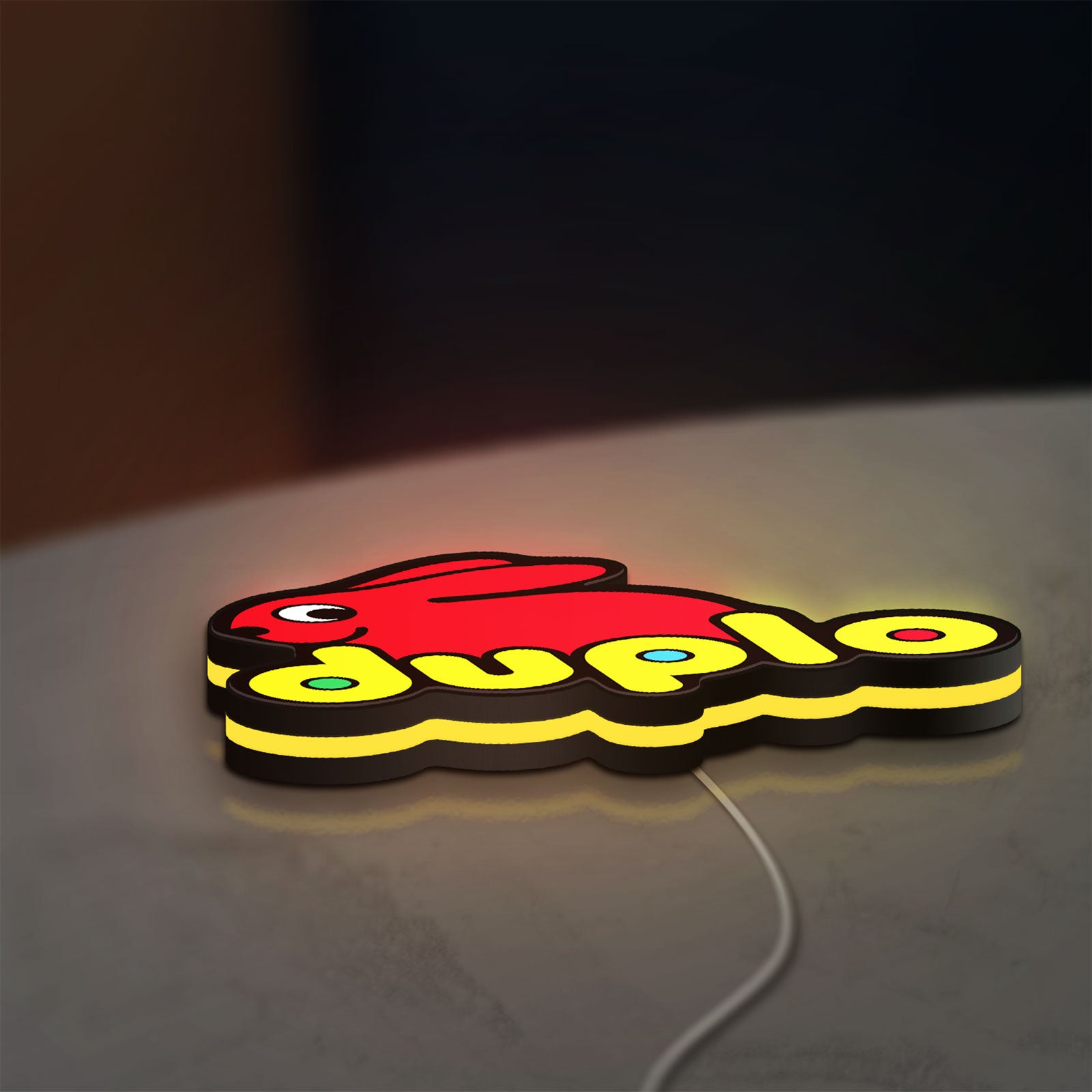 Duplo Lego LED lightbox lying flat on a desk with yellow glow