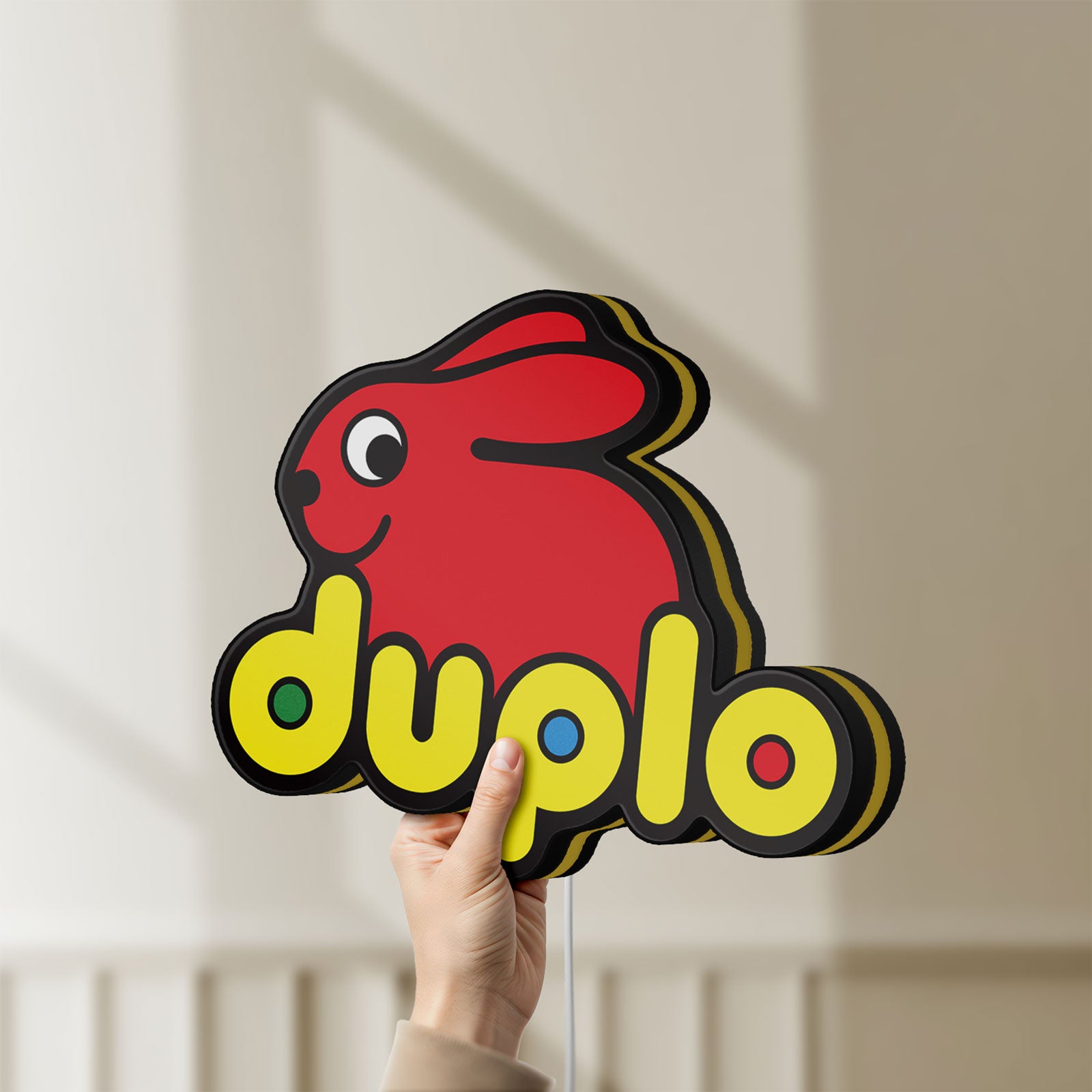Unlit Duplo Lego LED lightbox held by hand to show size and details