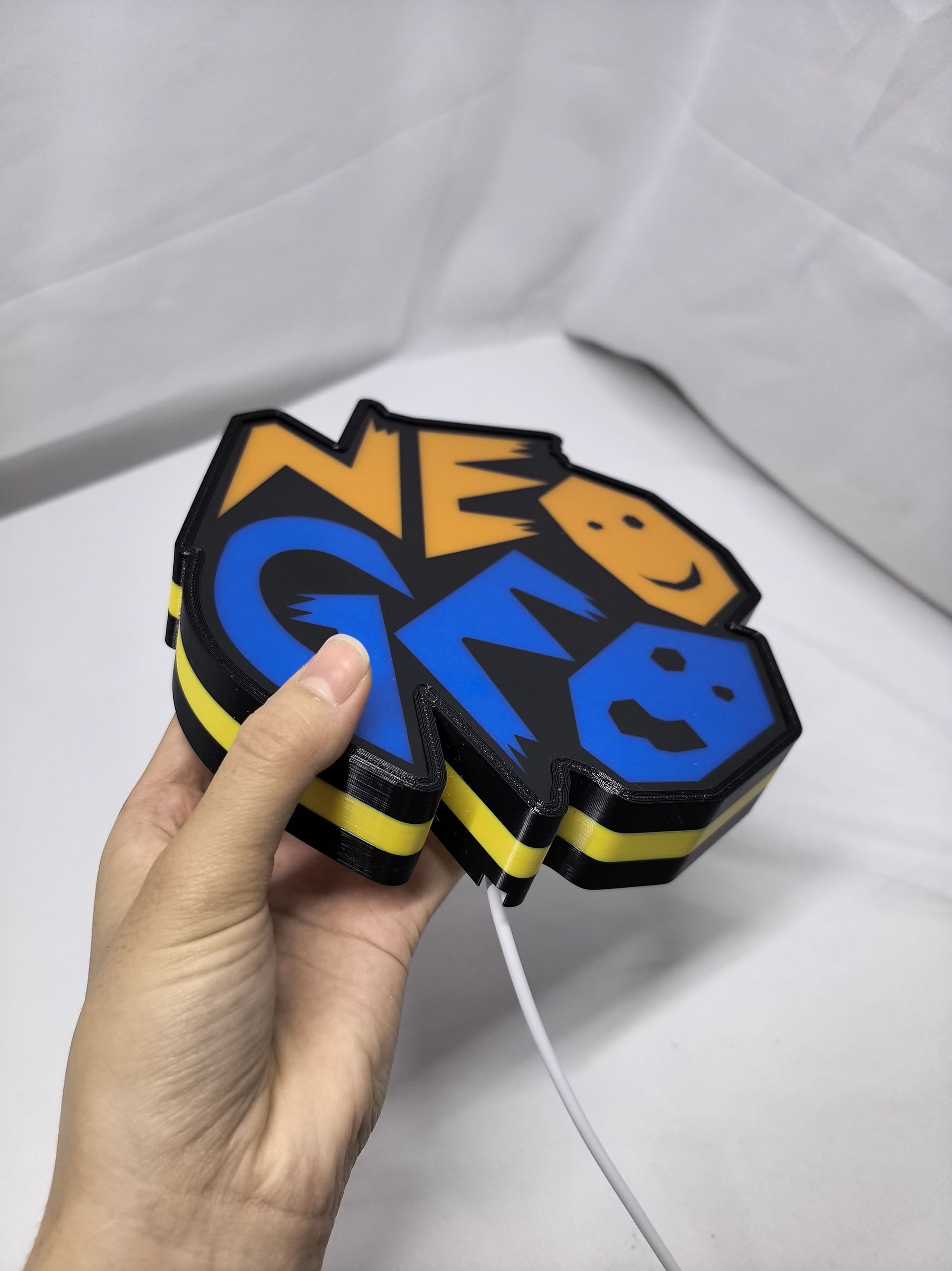 Unlit handheld size reference of Neo Geo Arcade 3D LED Sign in 20cm, unique wall art for desk and room decor