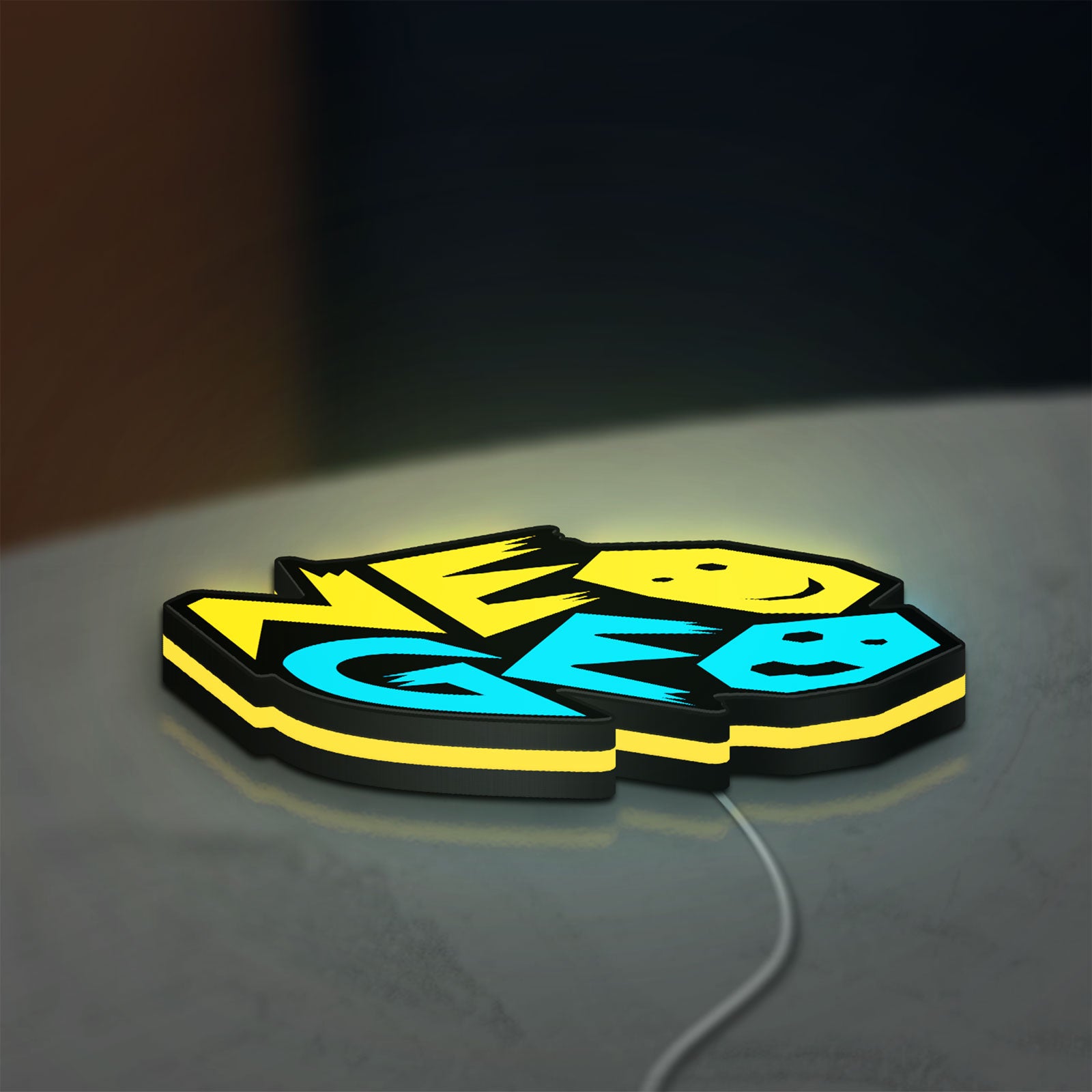 Neo Geo Arcade LED lightbox lying flat on a desk with yellow glow