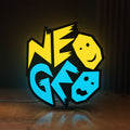 Front view of Neo Geo Arcade LED lightbox sign glowing on a wooden desk