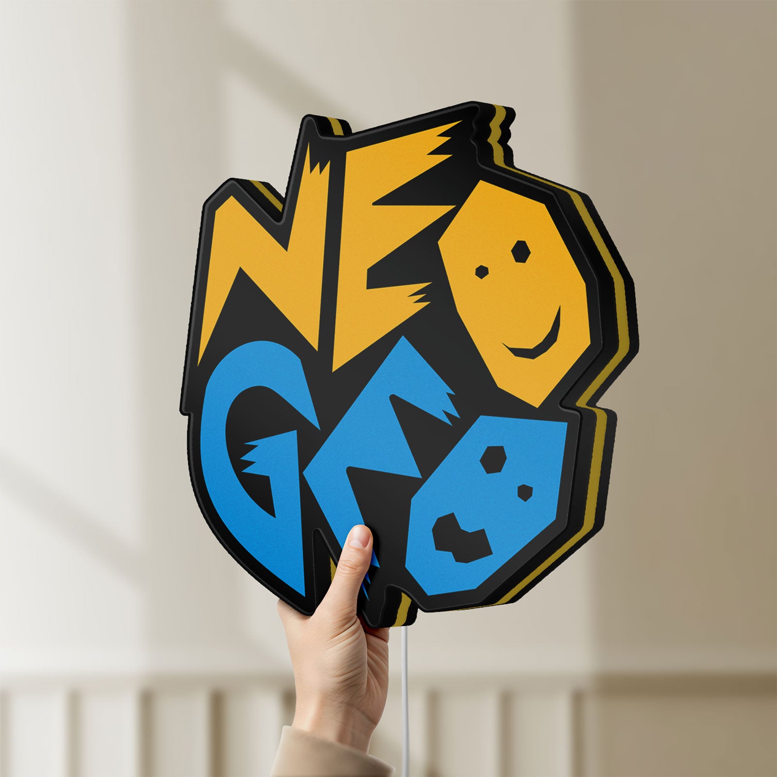 Unlit Neo Geo Arcade LED lightbox held by hand to show size and details