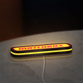 Matchbox LED lightbox lying flat on a desk with yellow glow