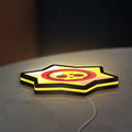 Brawl Stars LED lightbox lying flat on a desk with yellow glow