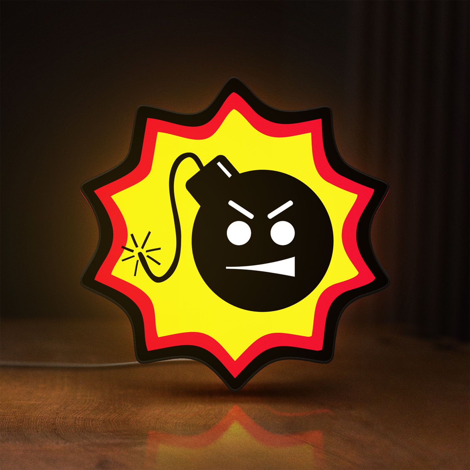 Front view of Serious Sam Bomb LED lightbox sign glowing on a wooden desk