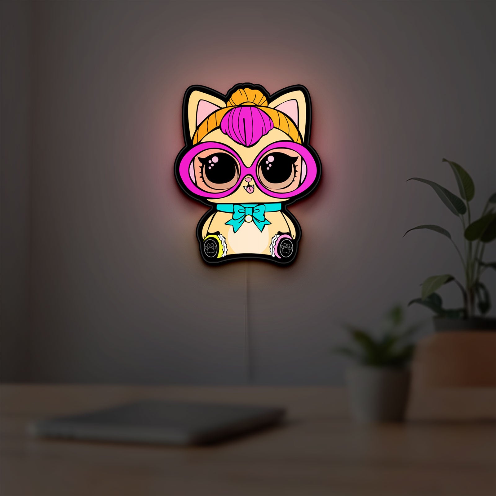 L.O.L Surprise Cat LED lightbox hanging on a room wall with soft yellow light
