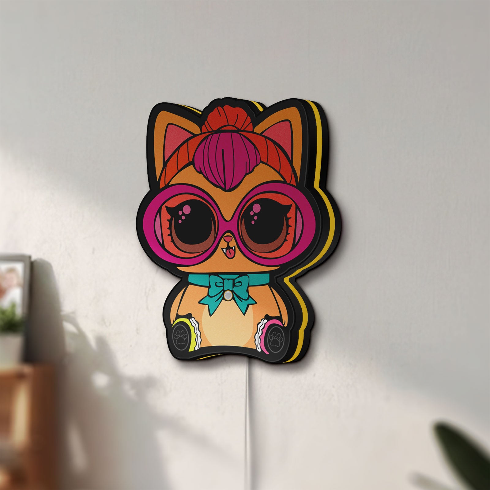 Unlit L.O.L Surprise Cat LED lightbox mounted on a wall in daylight