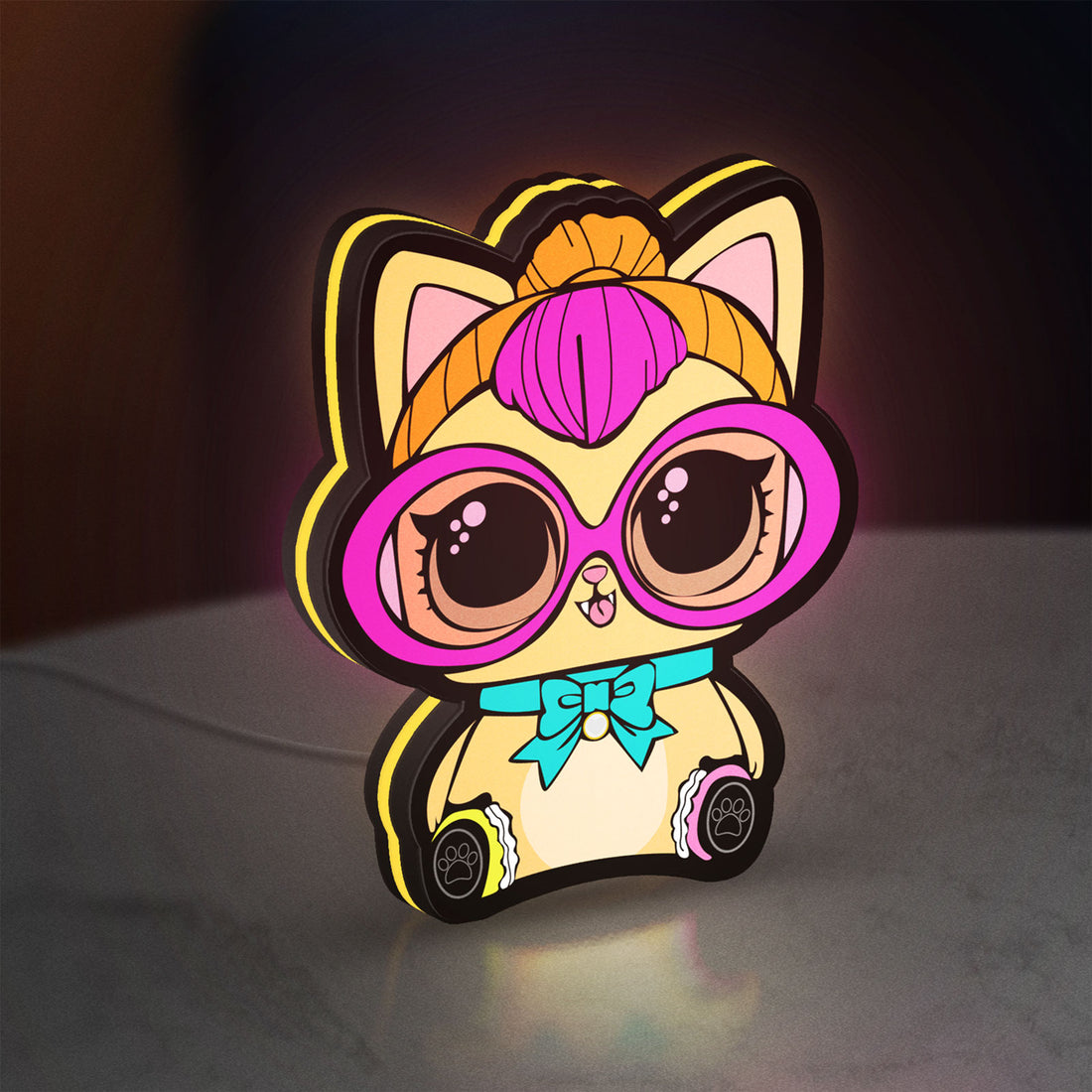 L.O.L Surprise Cat LED lightbox hanging on a wall with yellow glow