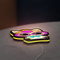 L.O.L Surprise Cat LED lightbox lying flat on a desk with yellow glow