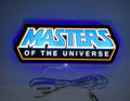 Illuminated flat lay front view of Masters Of The Universe 3D LED Sign in 30cm, unique wall art for desk and room decor
