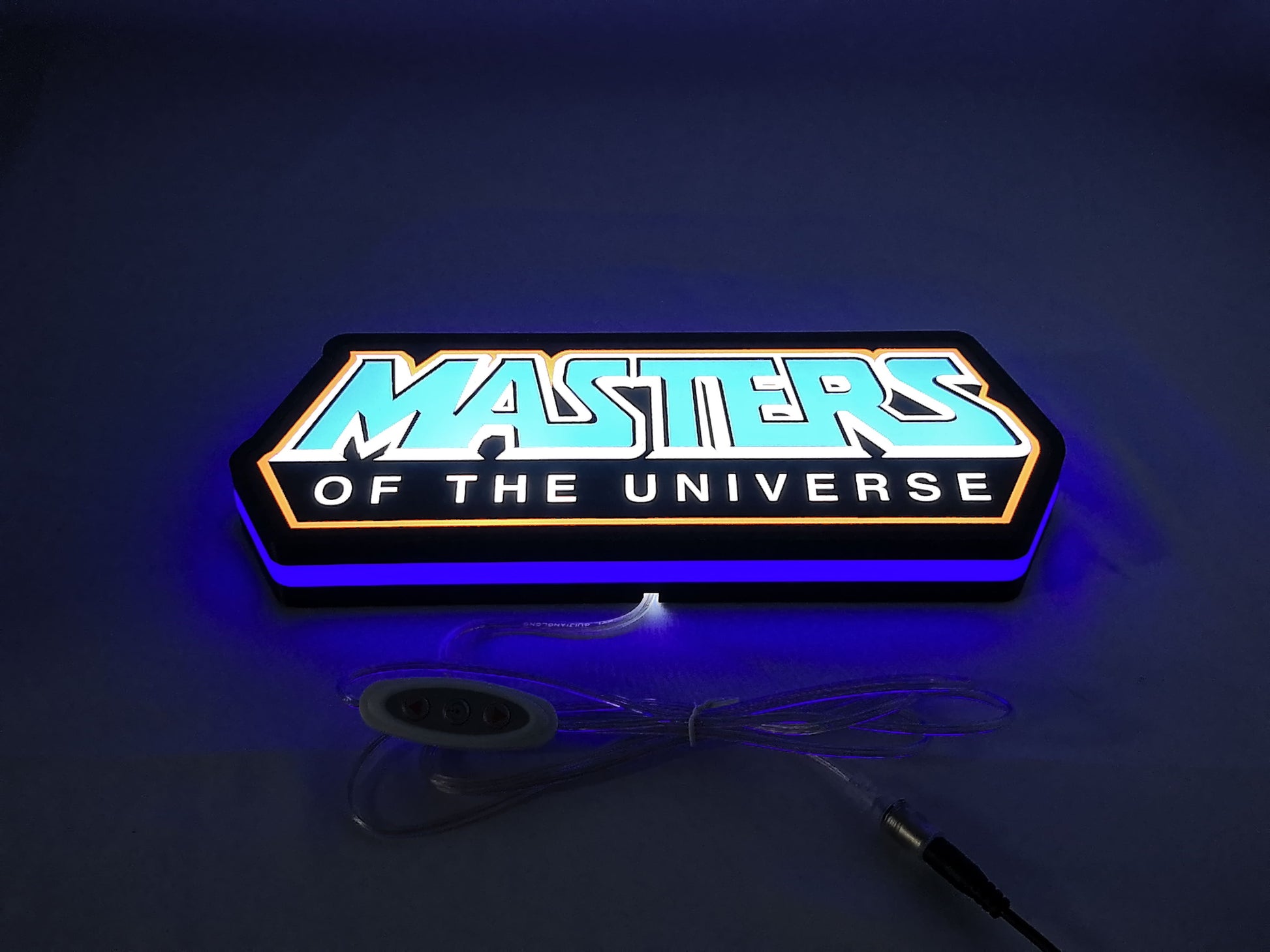 Masters Of The Universe LED Light Box (30cm) - Illuminated flat lay angled view, unique wall art for desk and room decor
