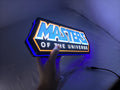 Illuminated handheld size reference of Masters Of The Universe Illuminated Sign in 30cm, unique wall art for desk and room decor