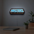 Masters of the Universe LED lightbox hanging on a room wall with soft blue light