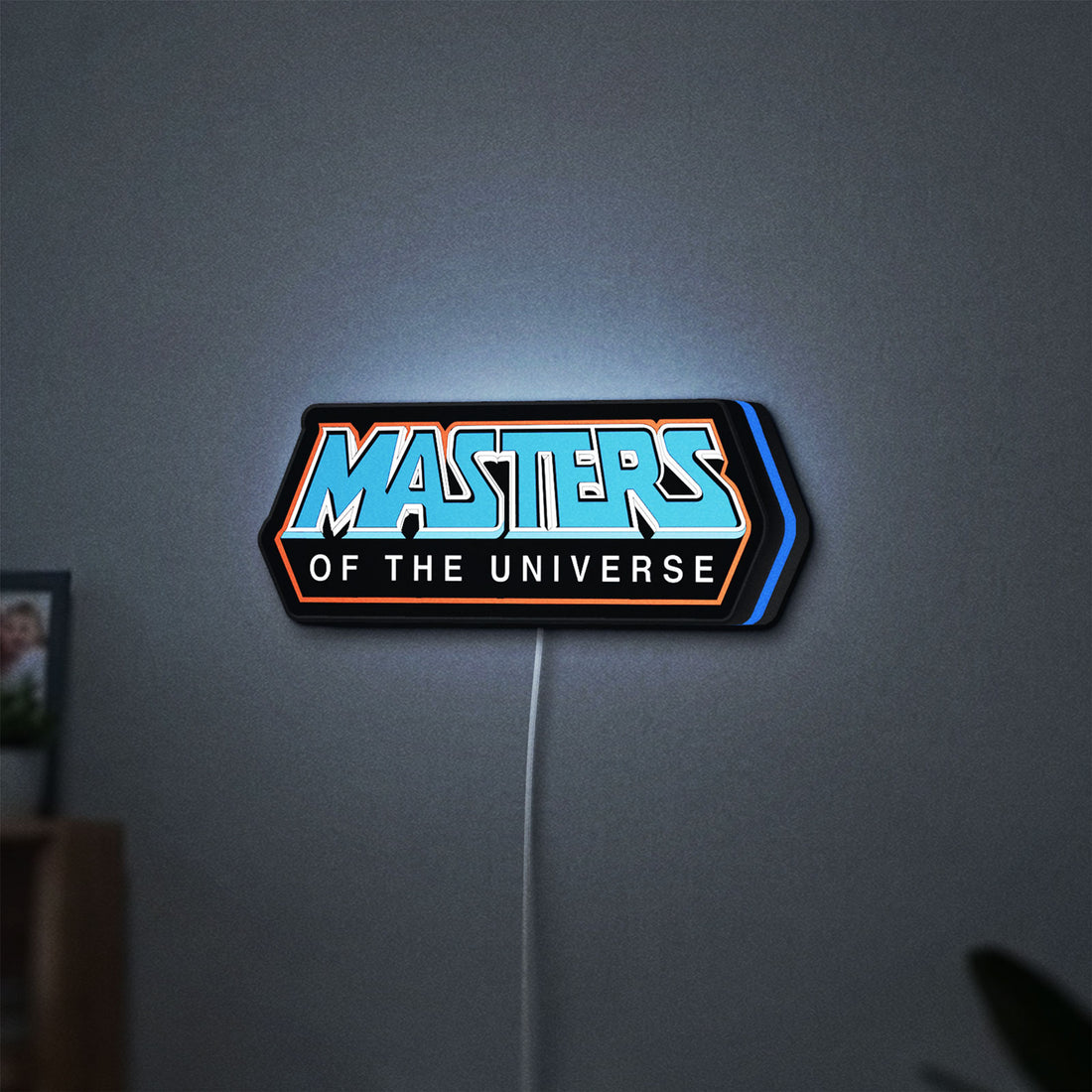 Masters of the Universe LED lightbox hanging on a wall with blue glow