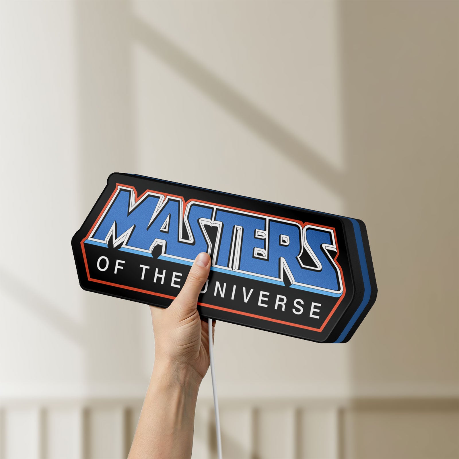 Unlit Masters of the Universe LED lightbox held by hand to show size and details