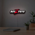 Boyztoys Racing LED lightbox hanging on a room wall with soft white light