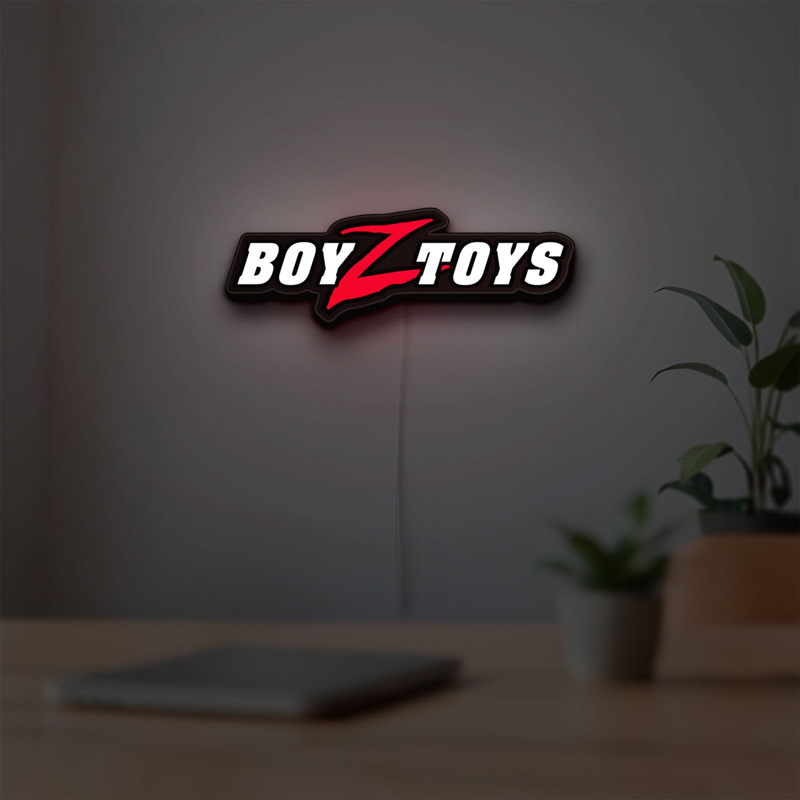 Boyztoys Racing LED lightbox hanging on a room wall with soft white light