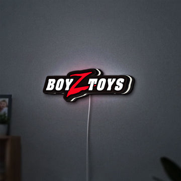Boyztoys Racing LED lightbox hanging on a wall with white glow
