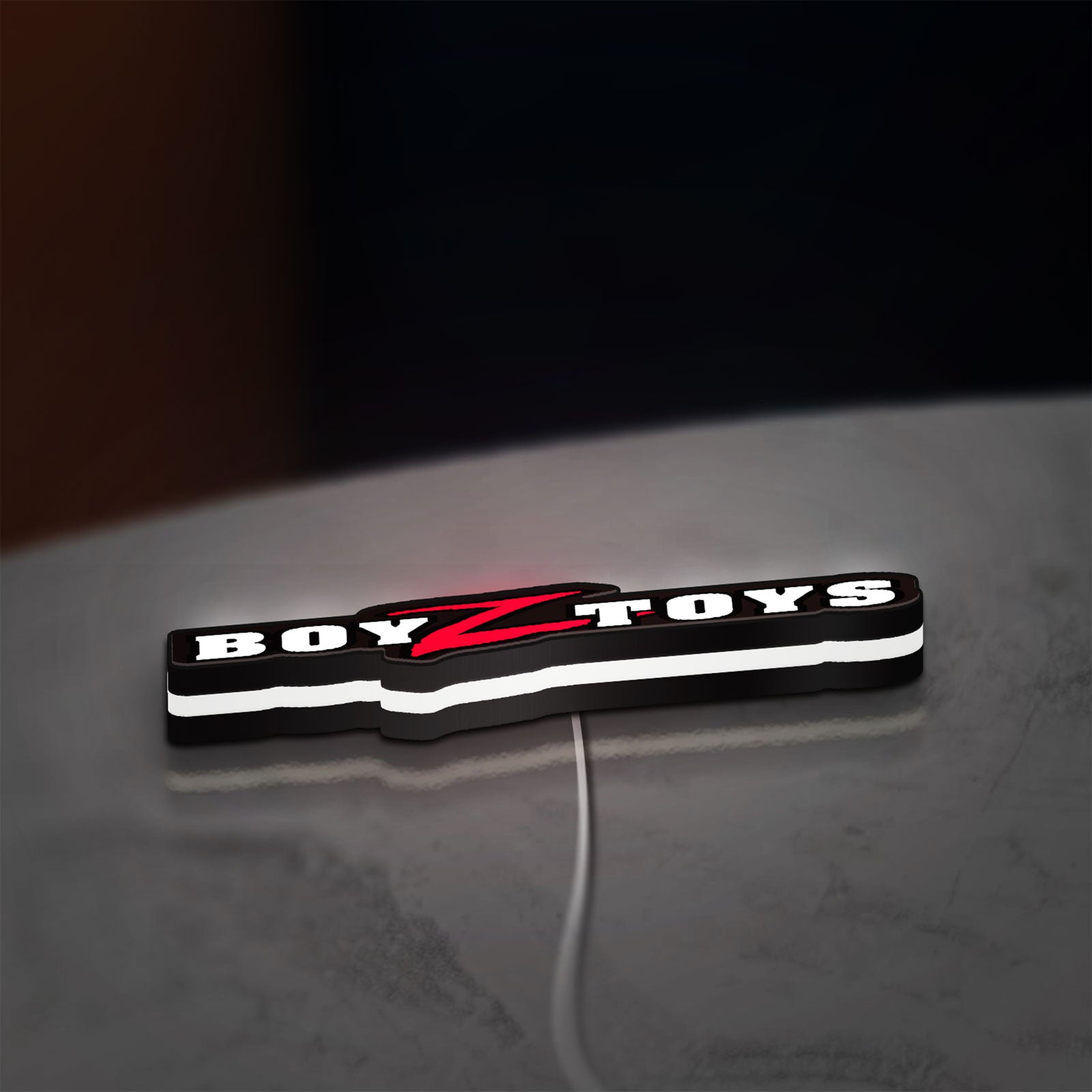 Boyztoys Racing LED lightbox lying flat on a desk with white glow