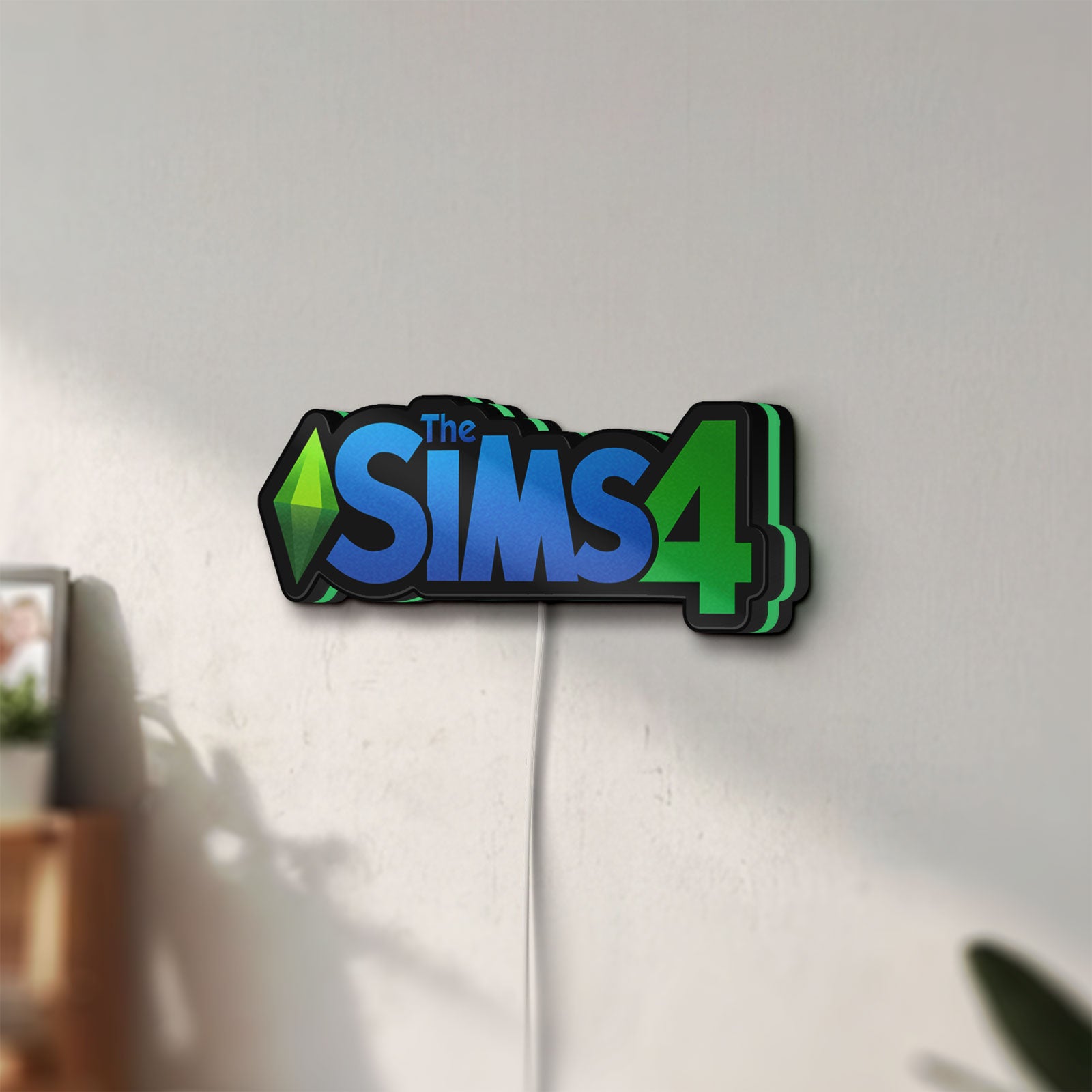 Unlit The Sims 4 Plumbob LED lightbox mounted on a wall in daylight