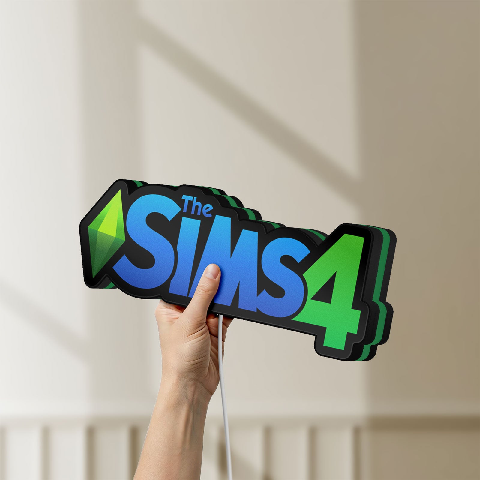 Unlit The Sims 4 Plumbob LED lightbox held by hand to show size and details