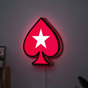 PokerStars Ace LED lightbox hanging on a wall with red glow