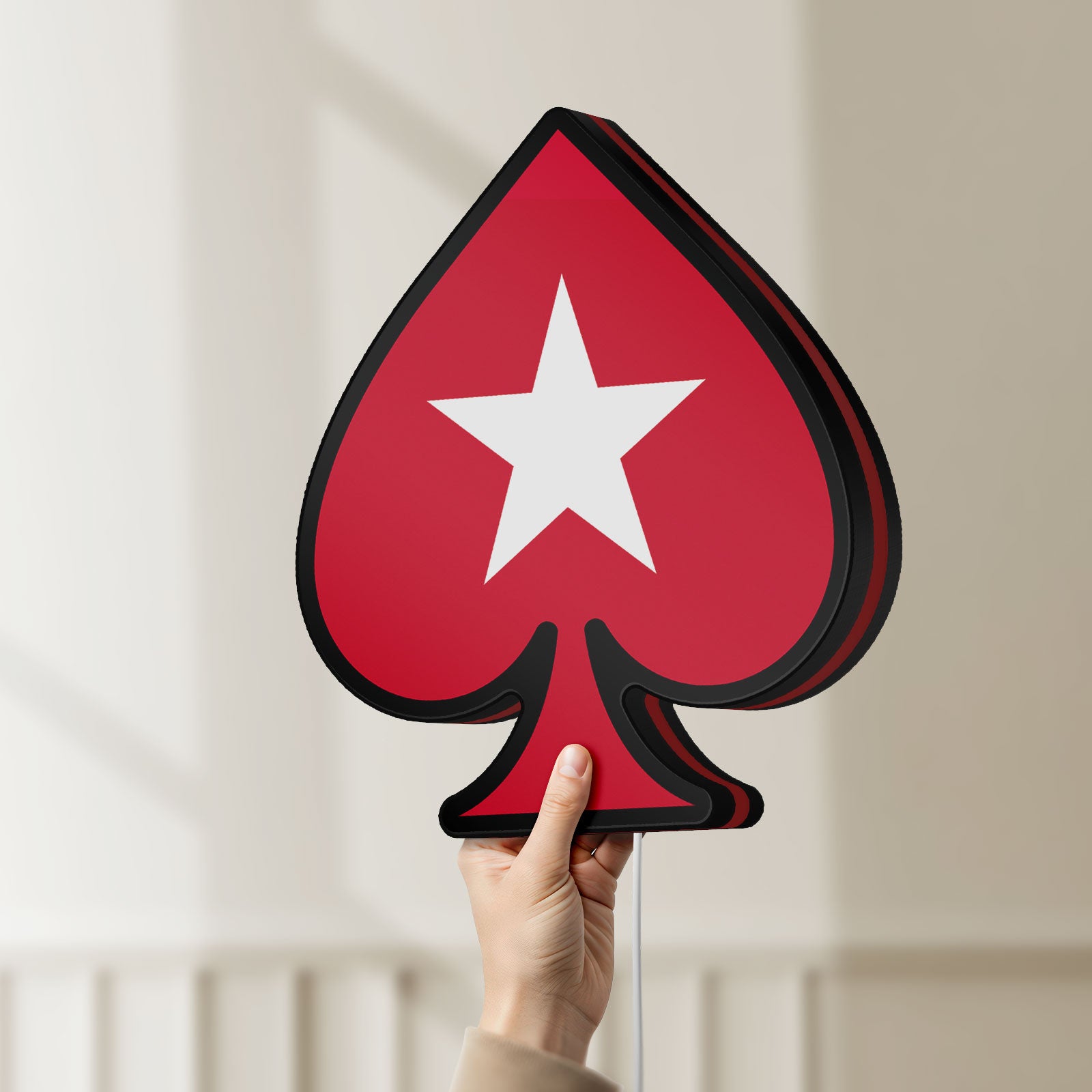 Unlit PokerStars Ace LED lightbox held by hand to show size and details