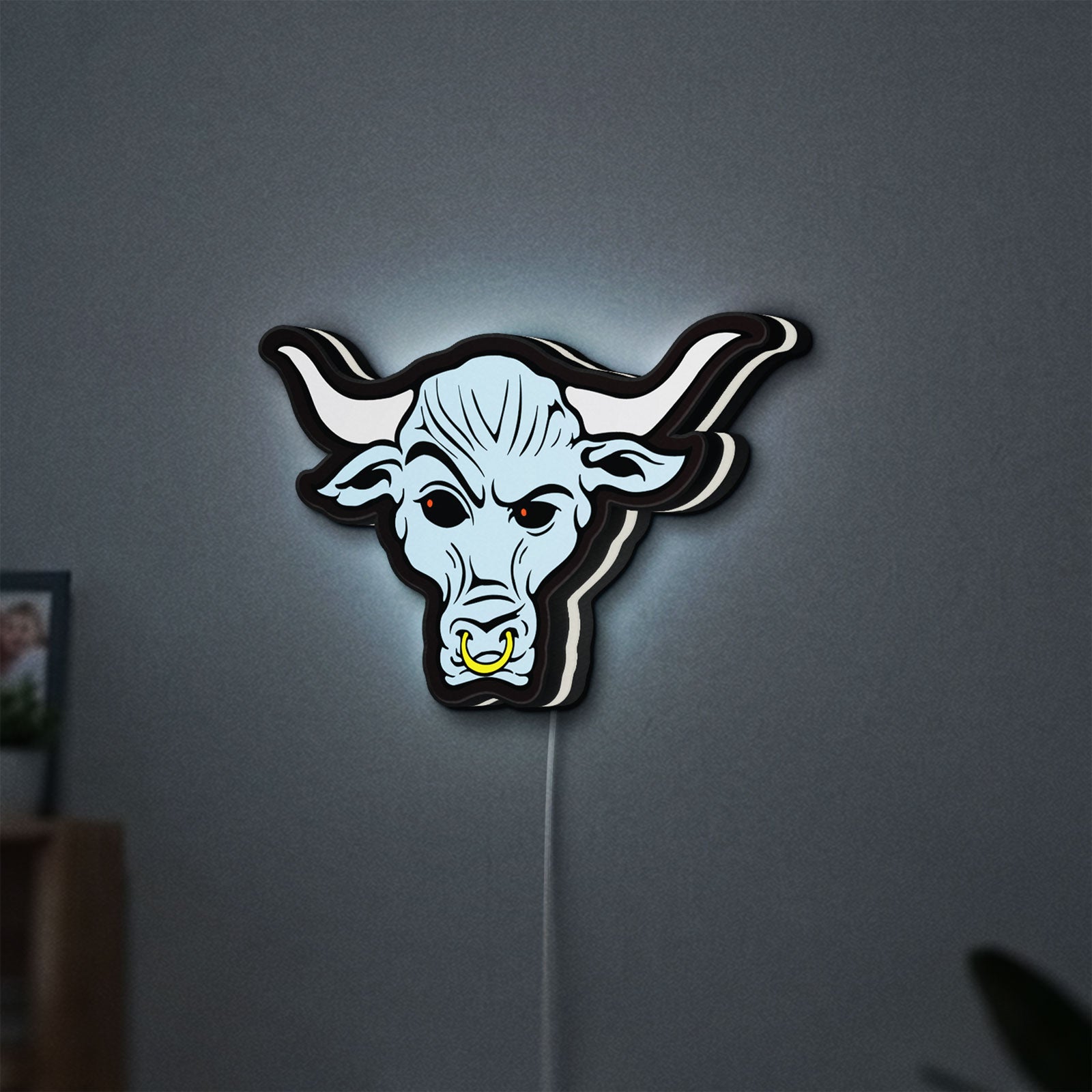 WWE Brahma Bull LED lightbox hanging on a wall with white glow