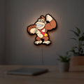 Donkey Kong LED lightbox hanging on a room wall with soft white light