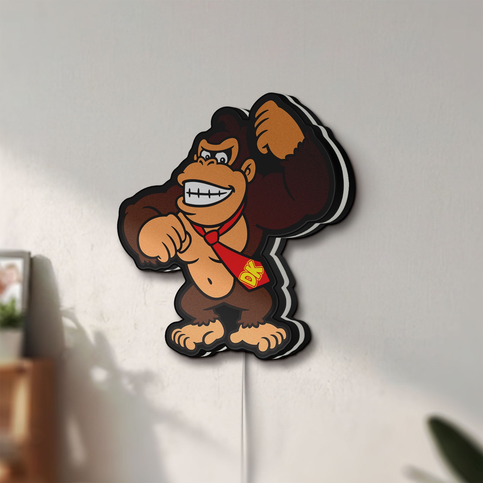 Unlit Donkey Kong LED lightbox mounted on a wall in daylight