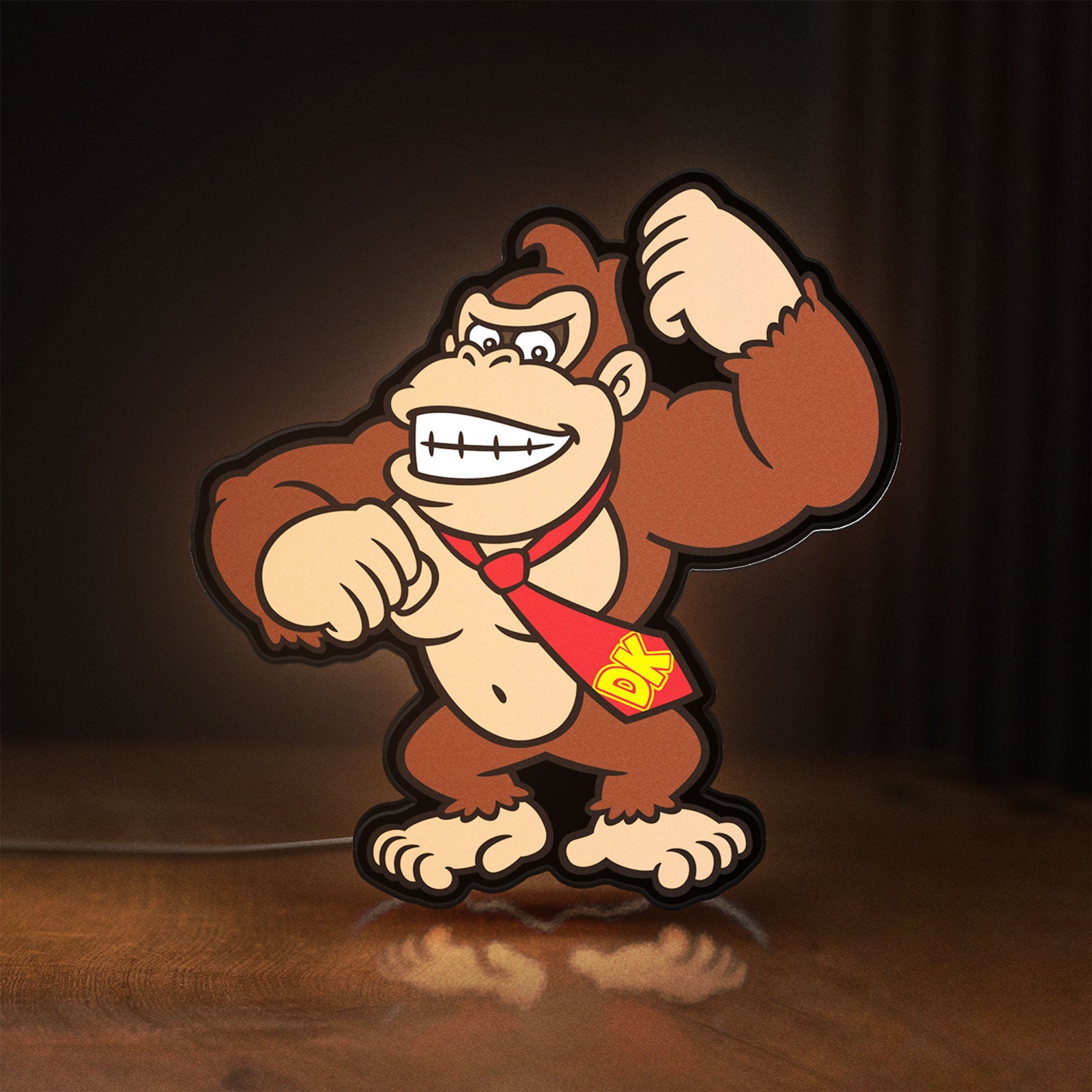 Front view of Donkey Kong LED lightbox sign glowing on a wooden desk