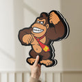 Unlit Donkey Kong LED lightbox held by hand to show size and details