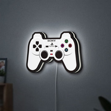 Sony PlayStation Pad LED lightbox hanging on a wall with white glow