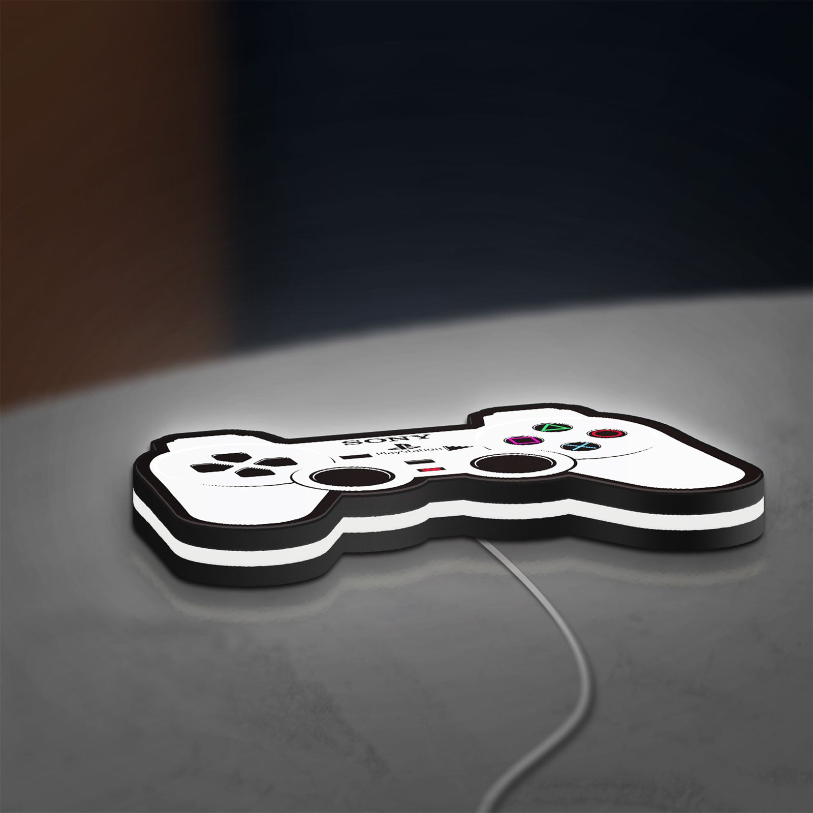 Sony PlayStation Pad LED lightbox lying flat on a desk with white glow