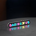 Babies R Us LED lightbox standing on a desk from an angled side view with white glow