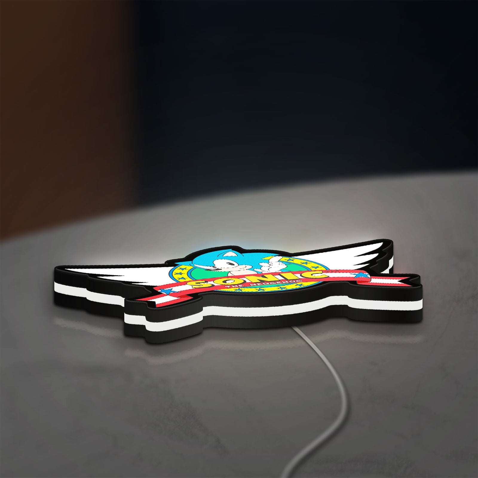 Sonic the Hedgehog LED lightbox lying flat on a desk with white glow